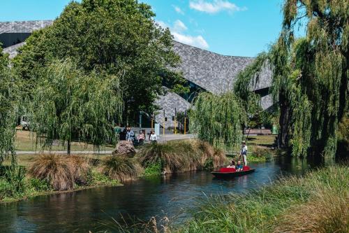 a group of people on a boat in a river at Family Friendly - Close to new stadium in Christchurch