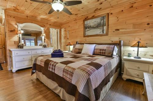 a bedroom with a bed in a log cabin at Living on the Ledge in Blue Ridge