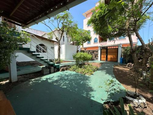 a walkway in front of a building with a staircase at The Finch House (La Casa del Pinzón) in Puerto Ayora