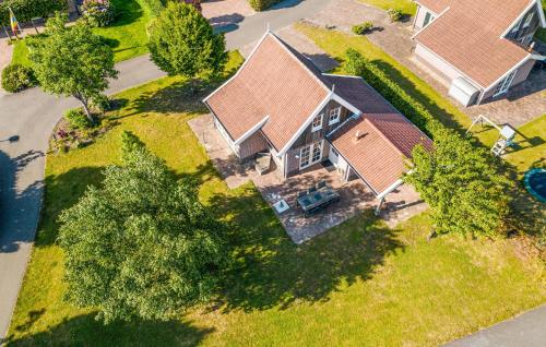 an overhead view of a house with a yard at Cozy Home In Hoge Hexel With Sauna in Hoge-Hexel
