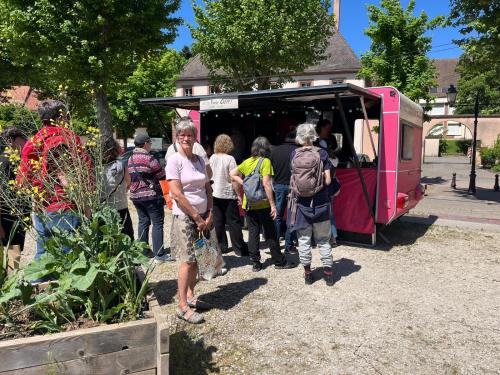 a group of people standing outside of a food truck at Le Haut Relais des Seigneurs - 5 mn Royal Palace de Kirrwiller in Bouxwiller