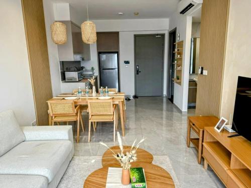 a living room with a couch and a table at Bintang Family suite at Agile TRX by KL in Kuala Lumpur