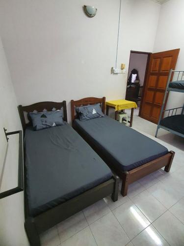 Katil atau katil-katil dalam bilik di O'Moona Homestay