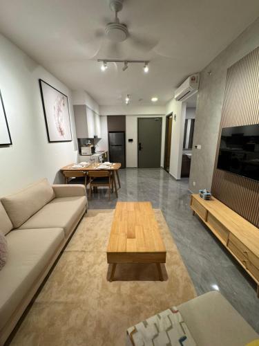 a living room with a couch and a table at Bintang Family suite at Agile TRX by KL in Kuala Lumpur