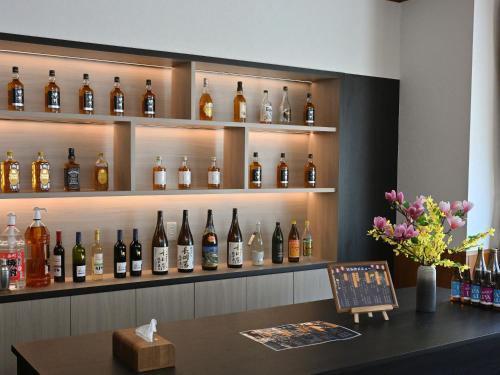 a display of bottles of wine in a bar at Komakusa Hotel in Matsumoto