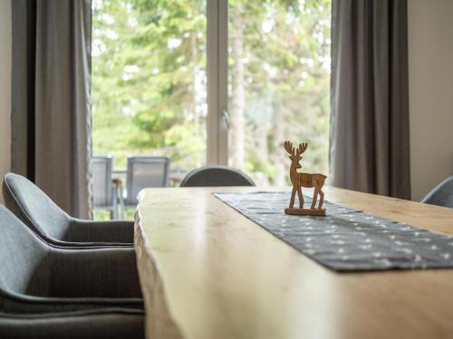 a small figurine of a deer sitting on top of a table at Chalet in Turracher Höhe with Ski Slope Access in Turracher Hohe