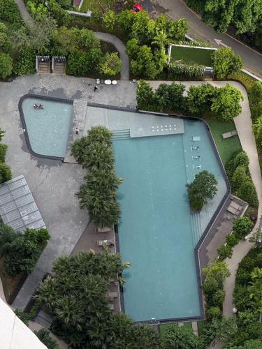 an overhead view of a swimming pool in a park at Bintang Family suite at Agile TRX by KL in Kuala Lumpur