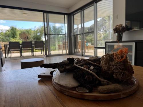 a room with a table with a pile of stuff on the floor at McCourt House in Capel