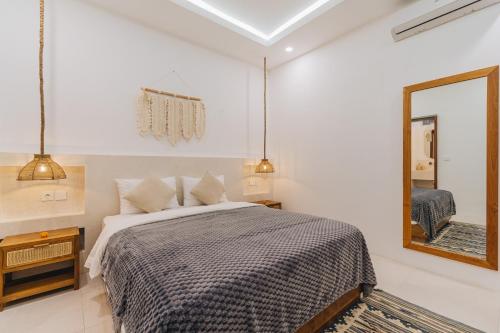 Ένα ή περισσότερα κρεβάτια σε δωμάτιο στο Villa Segara Angin