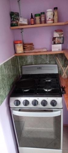 a white stove top oven in a kitchen at Lakeview Villa Santiago 2 in Santiago Atitlán