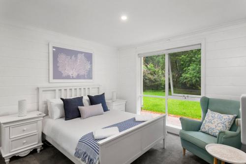 Ένα ή περισσότερα κρεβάτια σε δωμάτιο στο Coastal Rainforest Retreat