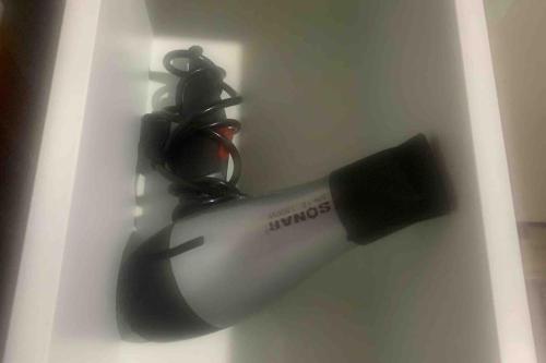 a hair dryer is attached to a wall at Casa de Campo Lake Shore Jocotepec in San Cristóbal Zapotitlán