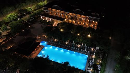 an overhead view of a swimming pool at night at Hotel Giannoulis in Paralia Katerinis