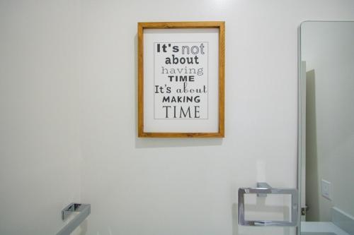 a framed picture on a wall in a bathroom at Cozy Downtown London 1BR Gem in London