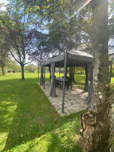 a gazebo with a picnic table in a park at Casa Giogo in Arezzo