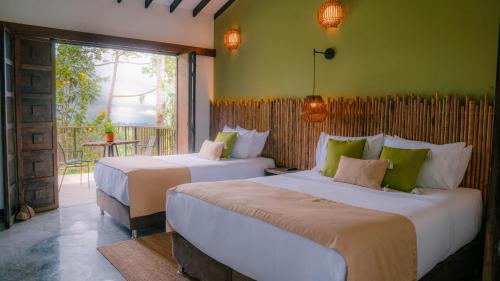 Tukki Ecolodge Hotelにあるベッド