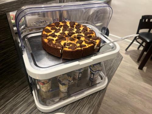 a cake sitting on a shelf in a refrigerator at Hotel Kiez Pension Berlin in Berlin