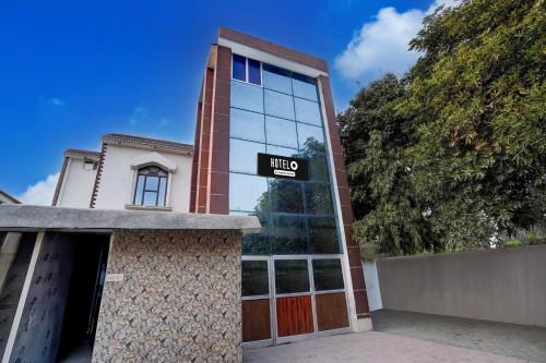 a building with a sign that reads the end at Hotel O Behror in Neemrana