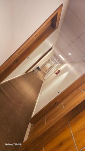 a ceiling in a room with wooden cabinets at The Monark Inn in Sandīla