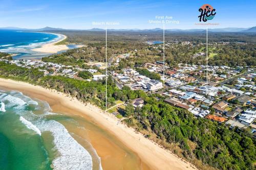 an aerial view of the shoreline of a beach at Rockpools 3 in Sawtell