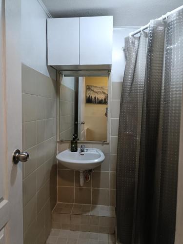 a bathroom with a sink and a mirror at 1bedroom one oasis condo fullyfurnished in Davao City
