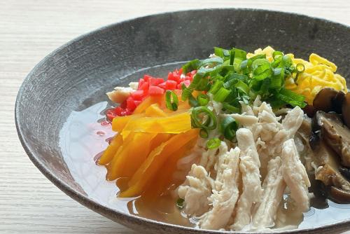 a plate of food with meat and vegetables in a bowl at Kagoshima Plaza Hotel Tenmonkan in Kagoshima