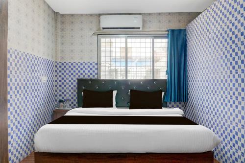 Ένα ή περισσότερα κρεβάτια σε δωμάτιο στο Hotel O Corporate Stay