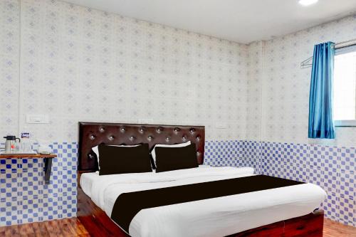 Ένα ή περισσότερα κρεβάτια σε δωμάτιο στο Hotel O Corporate Stay