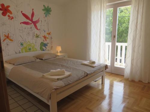 Posteľ alebo postele v izbe v ubytovaní Filipovic Apartments with Pool