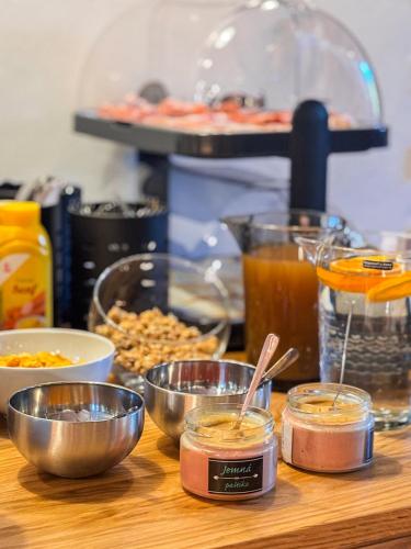 a table topped with bowls of food on a counter at Penzion Festung in Petrovice