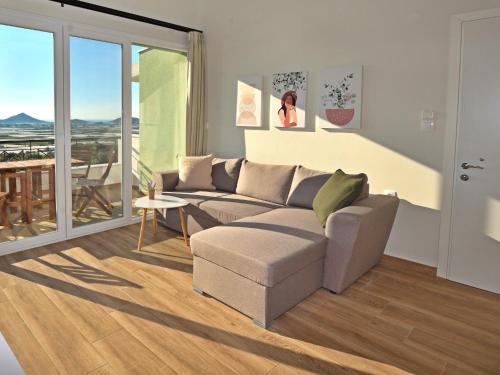 a living room with a couch and a table at 7 Grapes in Eleftheres