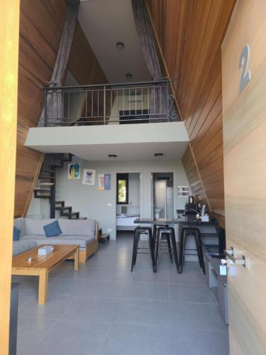 a living room with a couch and a staircase at Orion, Hills of Zaarour in Zaarour