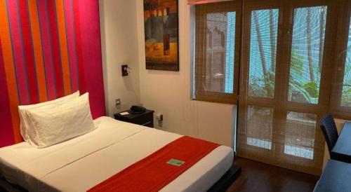 a bedroom with a bed and a window at D Villas in Colombo