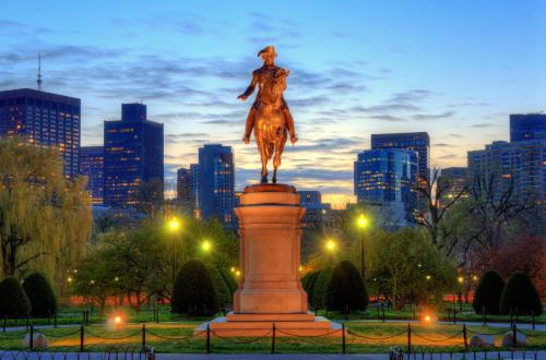 a statue of a man riding a horse in a city at Hyatt Regency Boston in Boston