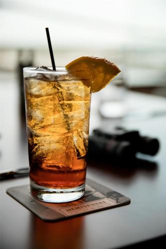 a drink on a table with a lemon slice at Hyatt Regency Orlando International Airport Hotel in Orlando