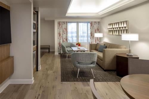 a living room with a couch and a table at Hyatt Regency Orlando International Airport Hotel in Orlando