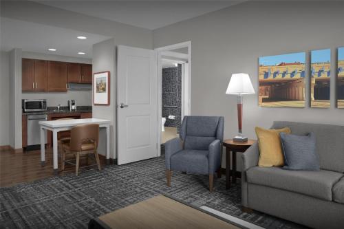 a living room with a couch and chairs and a table at Homewood Suites by Hilton Oklahoma City-Bricktown in Oklahoma City