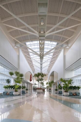 a large hallway with plants in a building at Hyatt Regency Orlando International Airport Hotel in Orlando