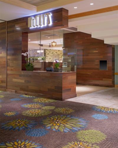 a lobby with a large mural on the wall at Hyatt Regency Orlando International Airport Hotel in Orlando