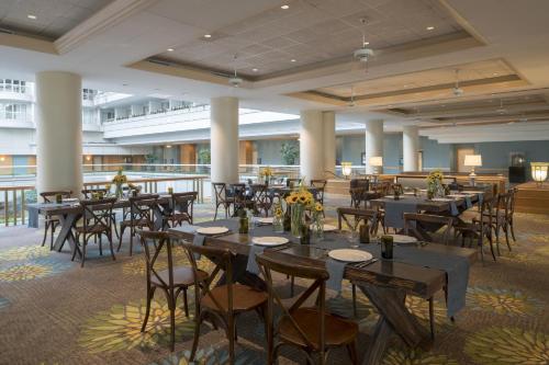 a banquet hall with tables and chairs in a building at Hyatt Regency Orlando International Airport Hotel in Orlando