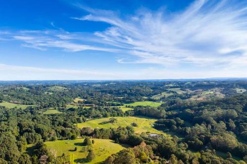 an aerial view of a field with trees at Luxury Mirror Home in Byron Bay Hinterland in Binna Burra