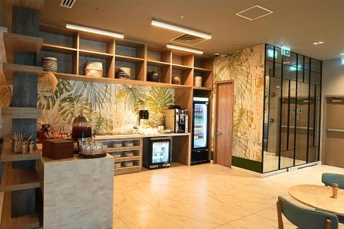 a large kitchen with a counter and a fireplace at Hilton Santa Marta in Santa Marta