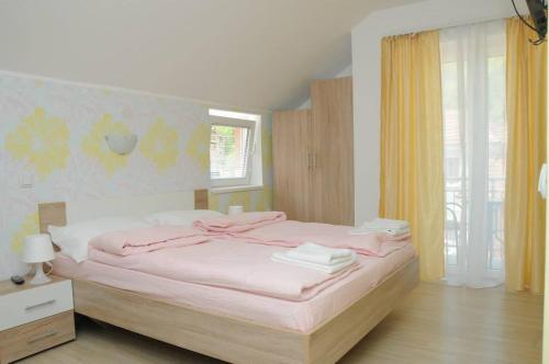 Ένα ή περισσότερα κρεβάτια σε δωμάτιο στο Apartments Kaskade