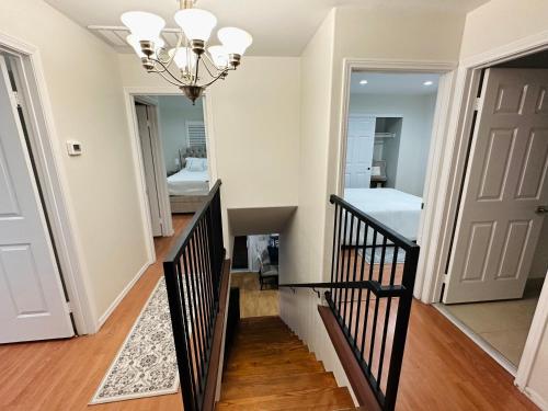 a hallway with a staircase and a room with a bed at Echo House in Los Angeles