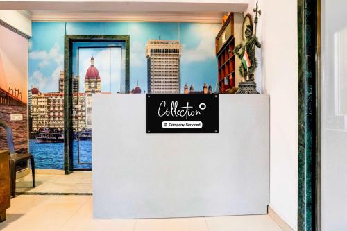 a sign on a wall with a view of the city at Collection O Four Bungalow in Upal