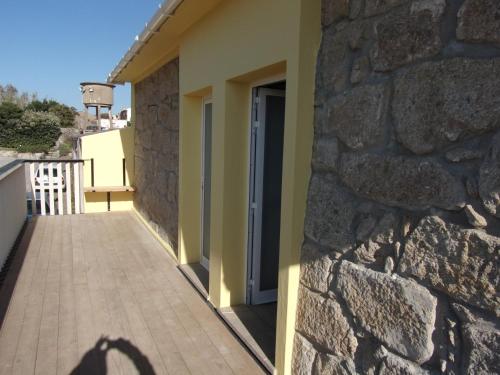 a shadow of a person standing next to a building at Casa Velha in Matosinhos