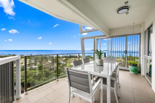 a dining room with a view of the ocean at Maroochy Sands Holiday Apartments in Maroochydore