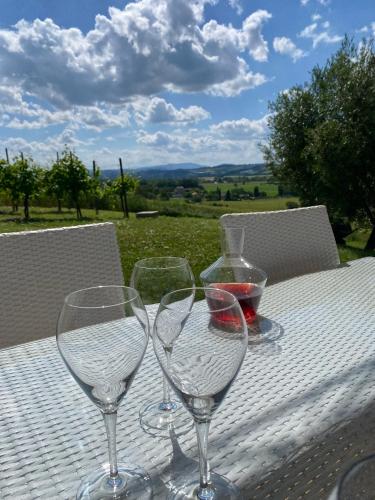 three wine glasses sitting on top of a table at Casalantico in Corinaldo