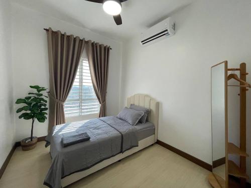 a bedroom with a bed and a window at Le Cozy Home KAJANG BANGI in Kajang