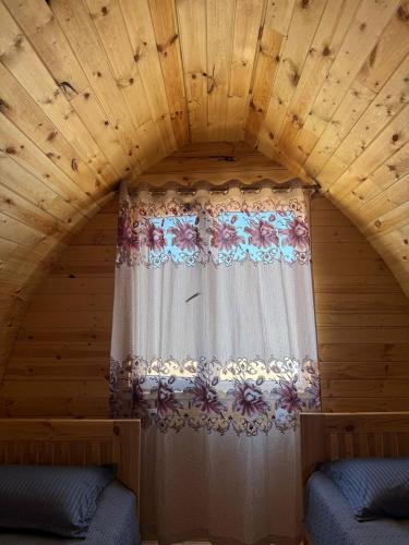 a room with a window with a curtain at Yurt camp Chyrak in Tong